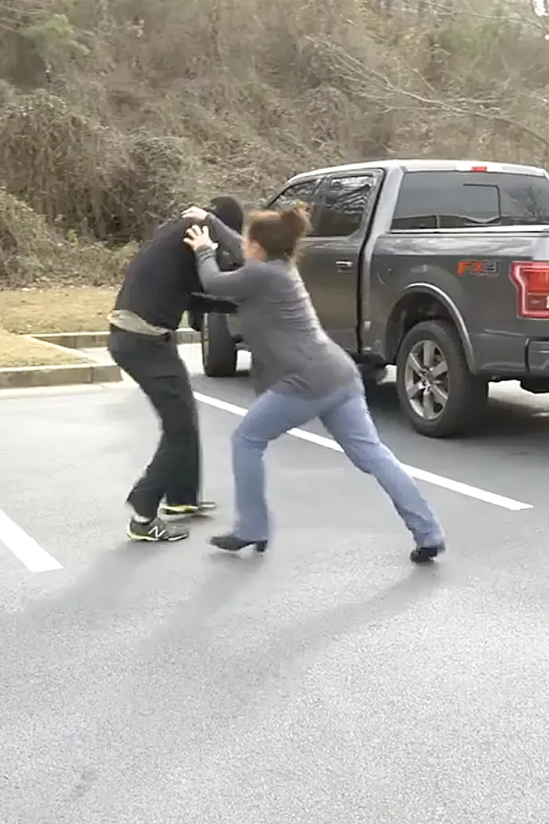 Adult Krav Pro student practicing purposeful movement through open training space.