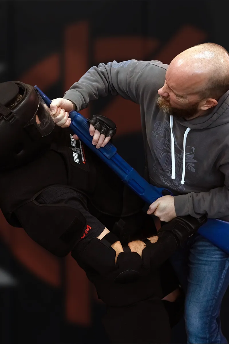 Adult Krav Pro students practicing movement and positioning during personal safety training.