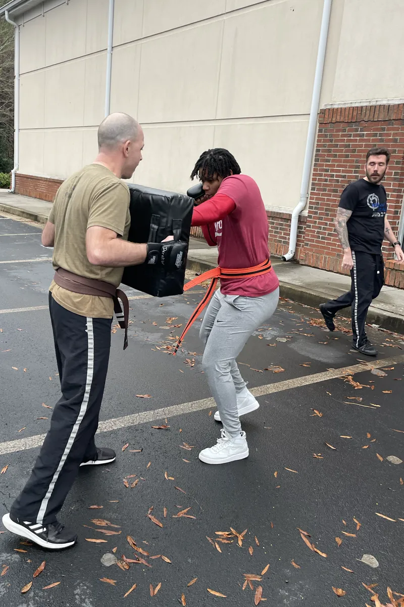 Adult Krav Pro students and instructors sharing an approachable training community.