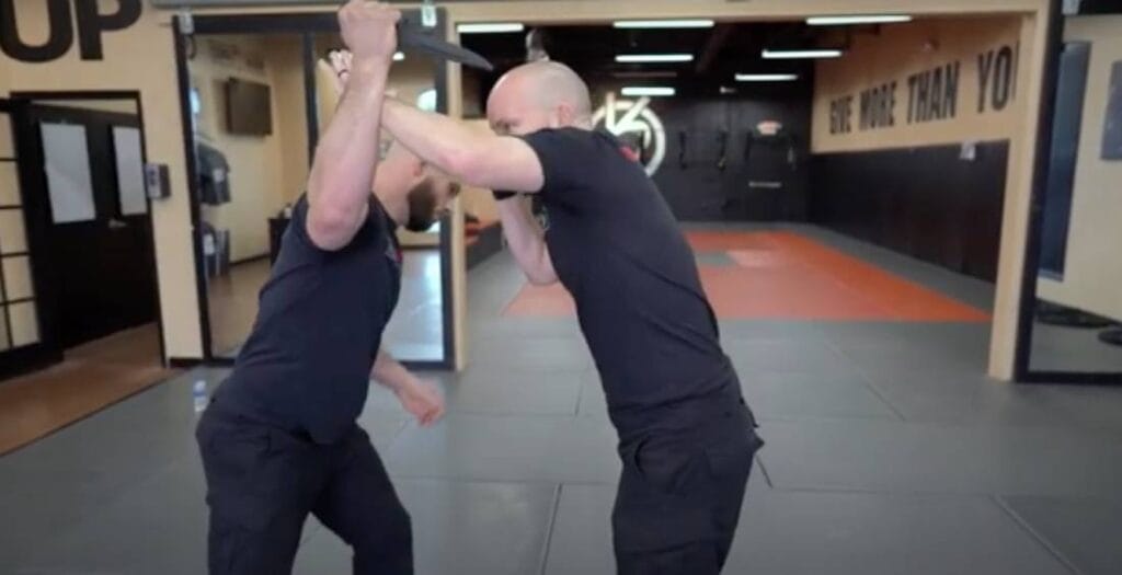 self defense classes with an instructor teaching a knife defense near Alpharetta, GA